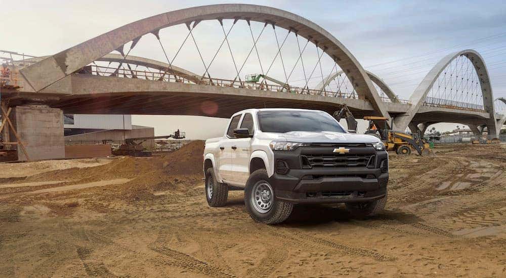 A white 2024 Chevy Colorado WT is shown from the front at an angle.