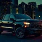 A black 2025 Chevy Silverado 1500 for sale in Knoxville is shown from the front at an angle.