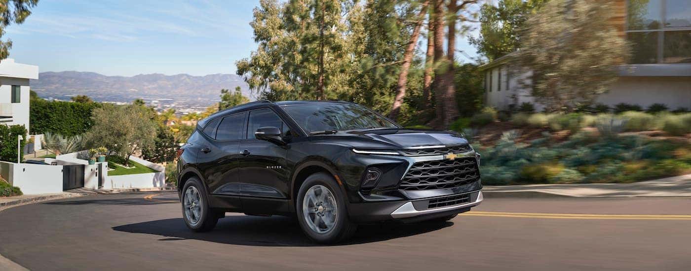 A grey 2025 Chevy Blazer for sale is shown from the front at an angle.