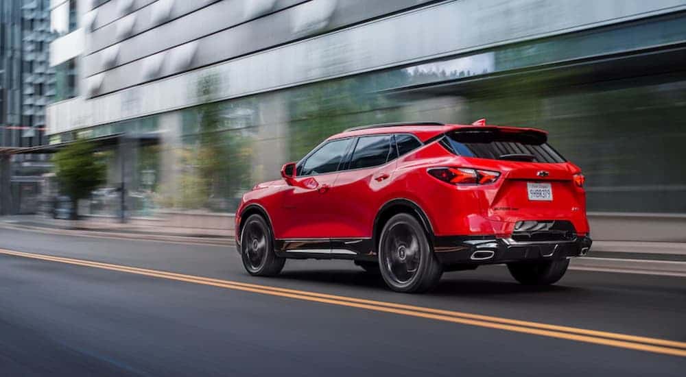A red 2025 Chevy Blazer RS is shown from the rear at an angle.