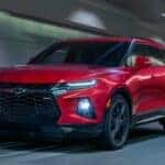 A red 2025 Chevy Blazer RS is shown from the front at an angle.