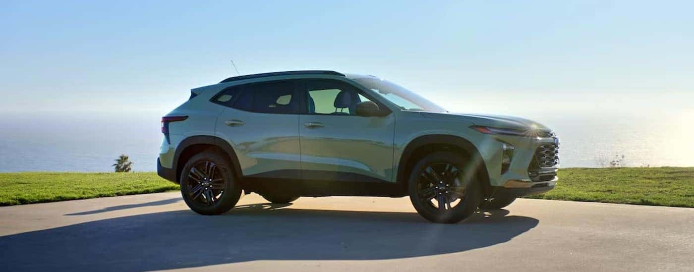 A green 2024 Chevy Trax parked on a sunny day.