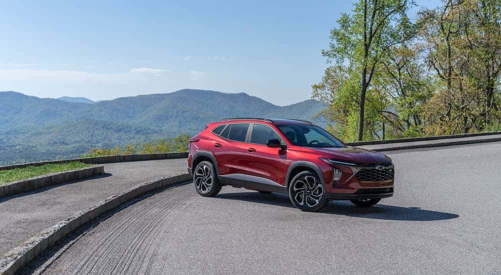 A red 2025 Chevy Trax from the side.