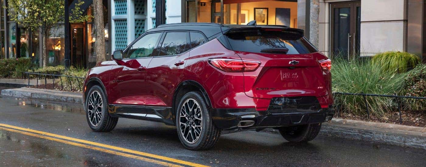 A red 2025 Chevy Blazer RS is shown from the rear at an angle.
