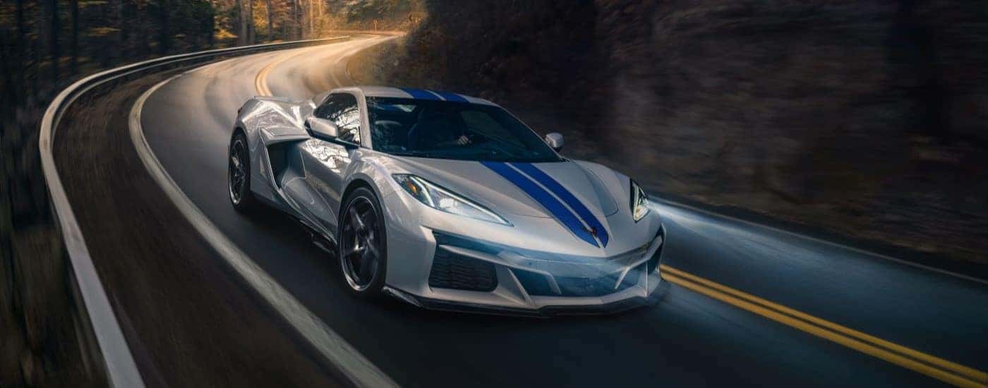 A silver 2024 Chevy Corvette E-Ray 3LZ is shown from the front at an angle.
