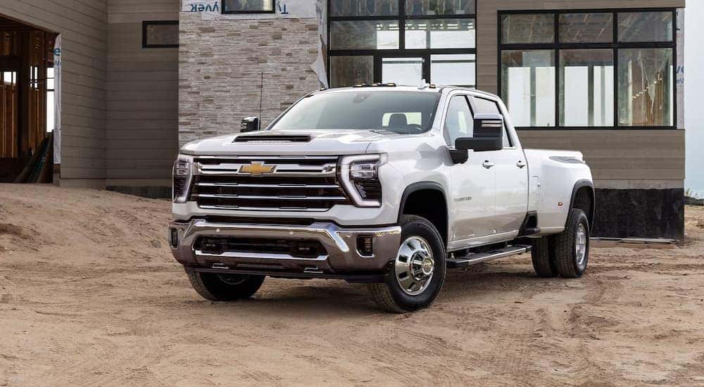 White 2025 Chevy Silverado 3500HD for sale parked at a construction site