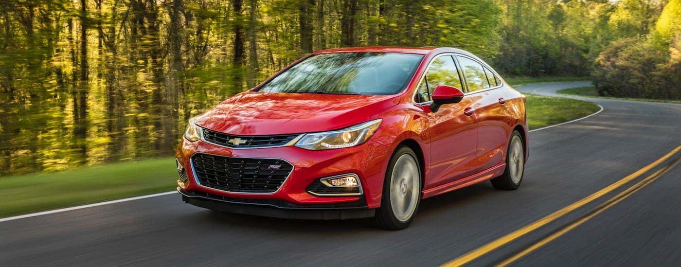 A red 2016 Chevy Cruze from the front at an angle after the owner researched how to 'sell my car.'