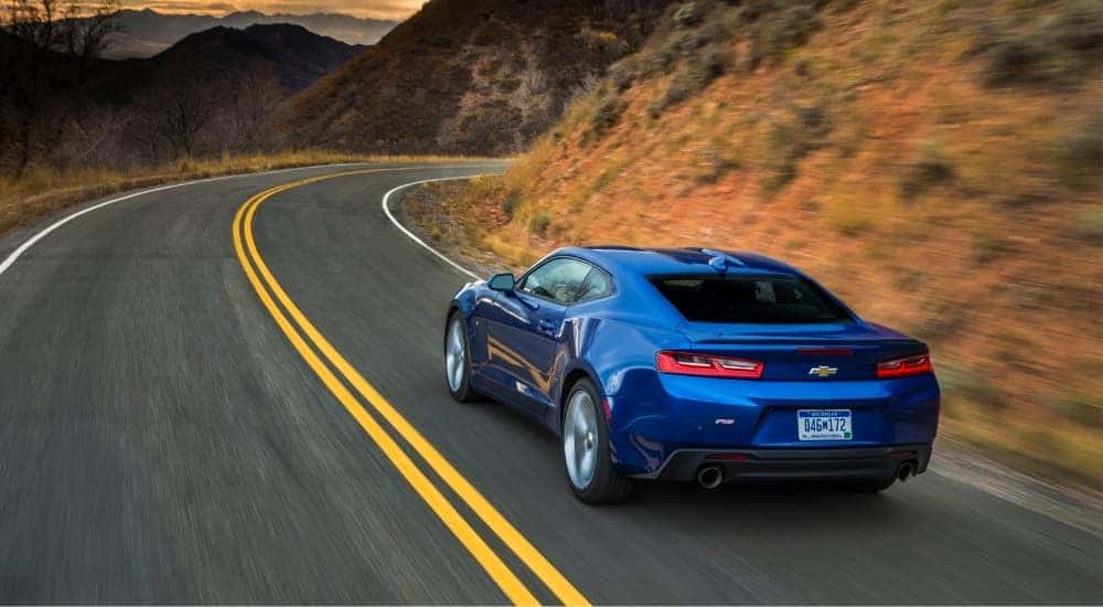 A blue 2016 Chevy Camaro from the rear at an angle after the owner searched how to 'sell my car'.