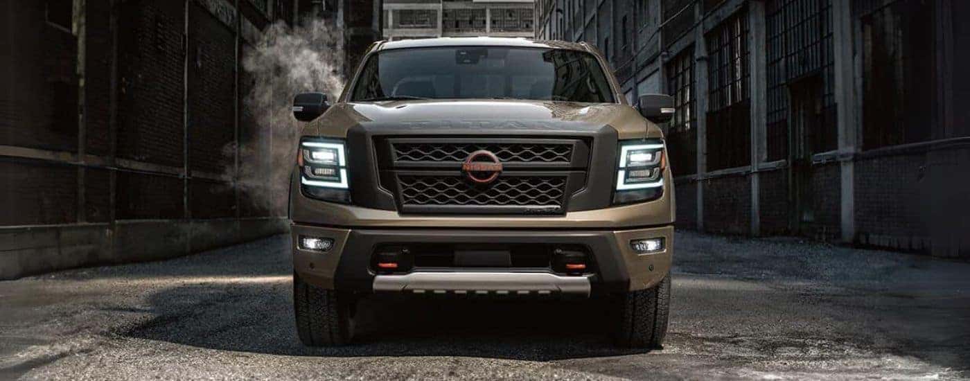 Front of a brown 2024 Nissan Titan parked in an alleyway