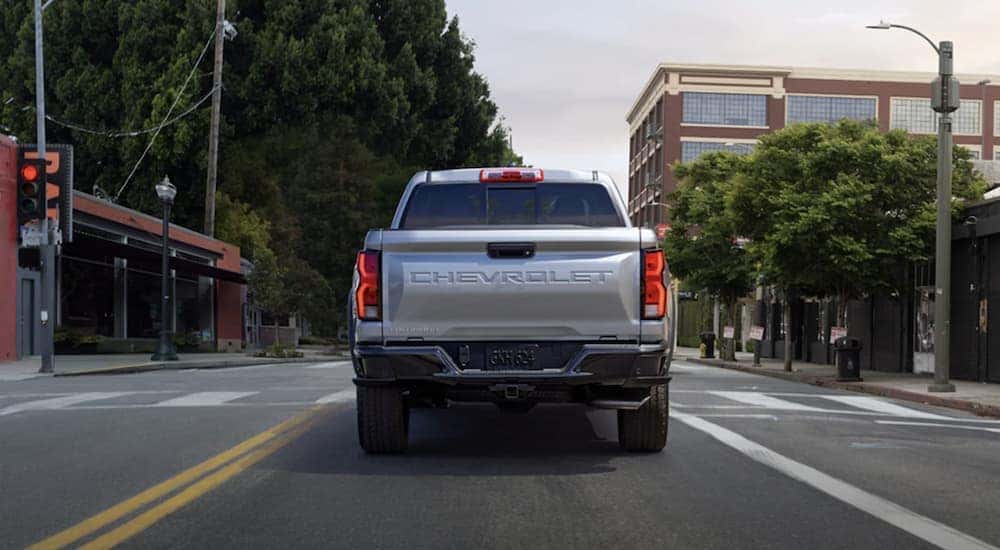 Silver 2023 Chevy Colorado stopped at a red light.