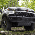 White 2026 Chevy Silverado 1500 ZR2 Bison Edition driving off-road