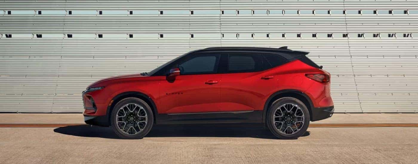Red 2023 Chevy Blazer parked against a wall