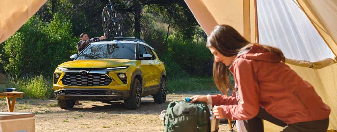 Yellow 2024 Chevy Trailblazer ACTIV on a camp site