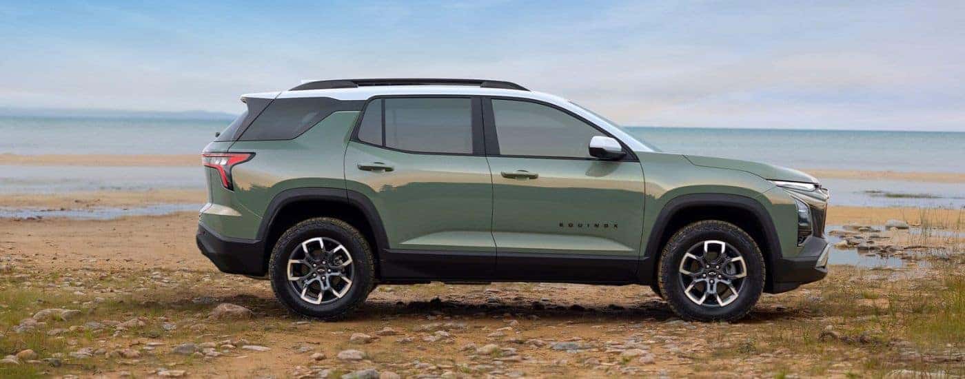 Green 2025 Chevy Equinox ACTIV parked by water