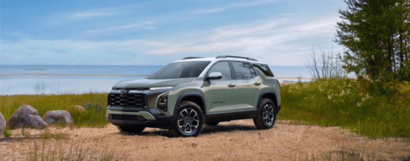 Green 2025 Chevy Equinox ACTIV parked on gravel