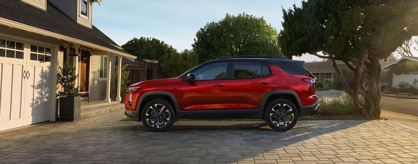 Red 2025 Chevy Equinox parked in a driveway