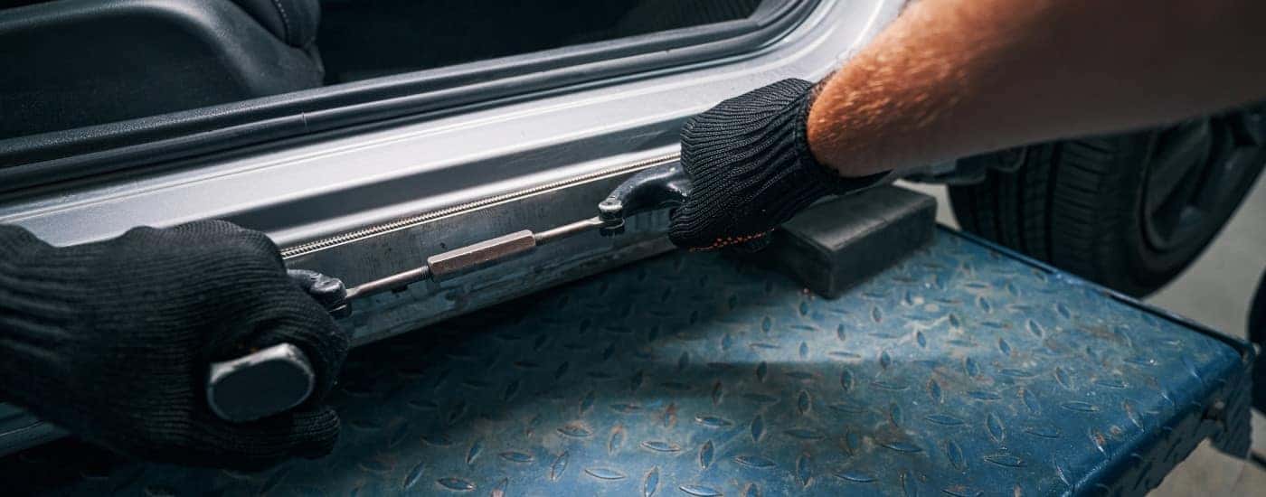 Technician performing auto body repair