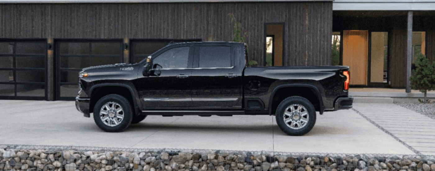 Black 2024 Chevy Silverado 2500 HD High Country in a driveway