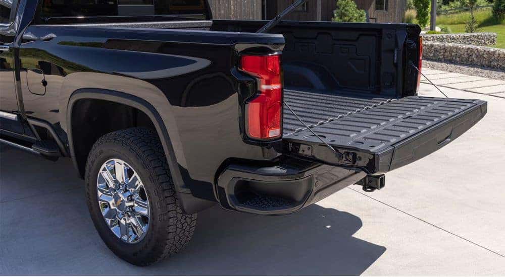 Rear gate down on the bed of a black 2026 Silverado 2500 HD.