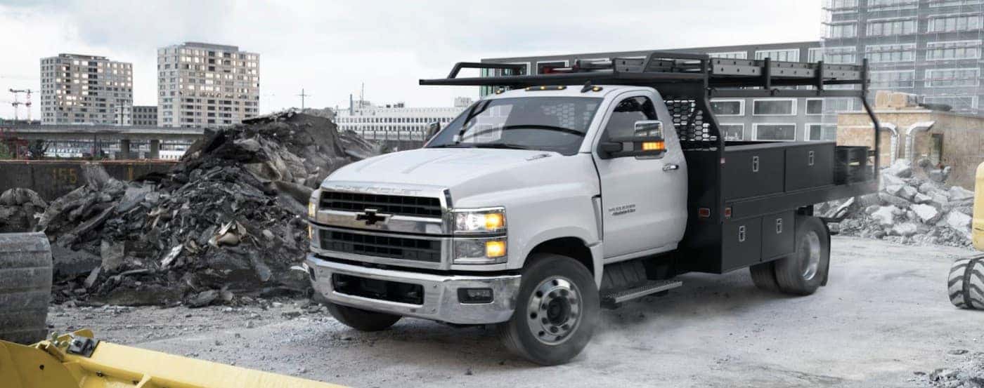 A white 2025 Chevy Silverado 4500 parked on a job site.