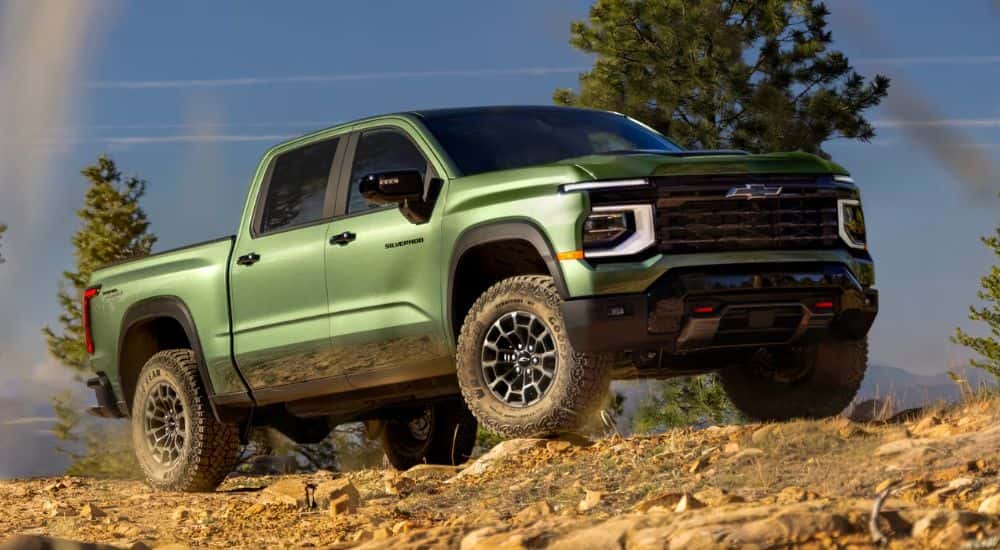 A green 2027 Chevy Silverado 1500 parked off-road.