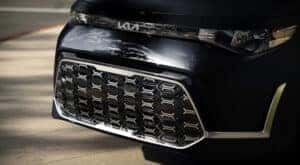 A close-up of the grille on a black 2024 Kia Soul for sale.