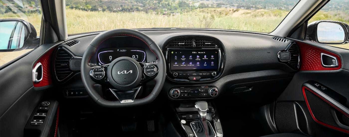 The black and red cabin of a 2024 Kia Soul.