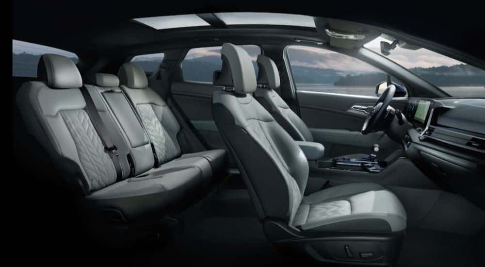 The gray interior is shown in a 2025 Kia Sportage X-Pro Prestige.