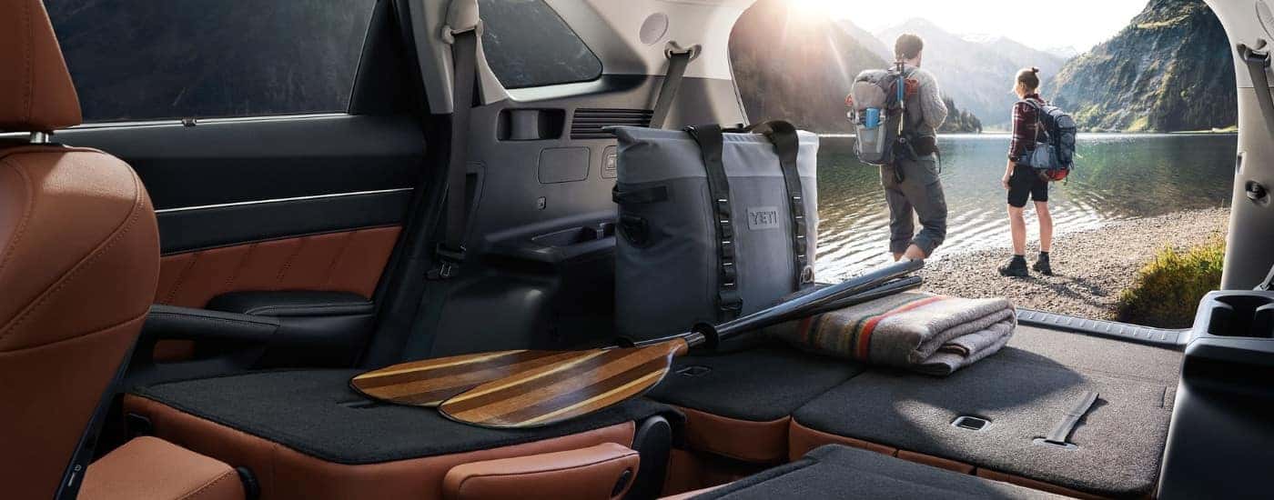 Hikers are shown near a 2023 Kia Sorento.
