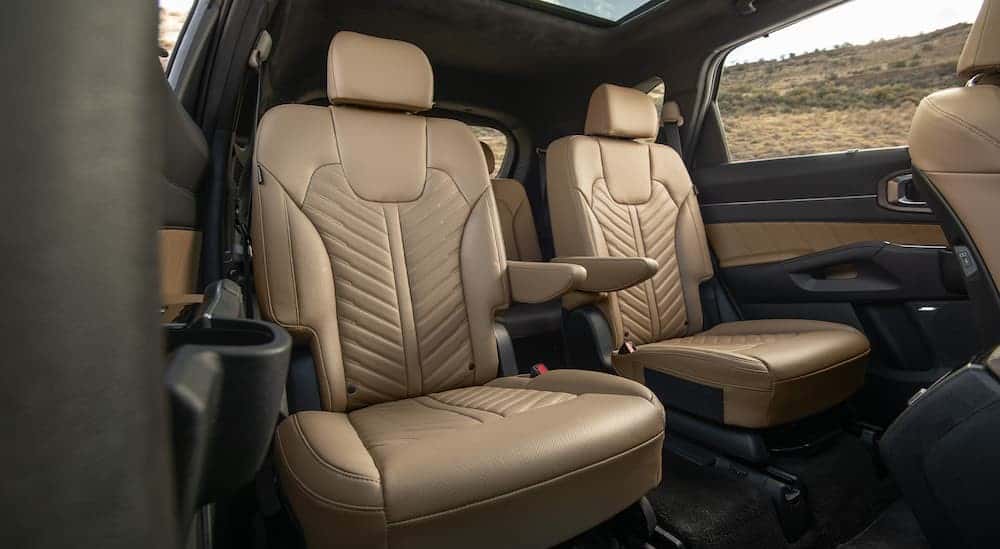 The black and tan rear seating area is shown in a 2025 Kia Sorento.