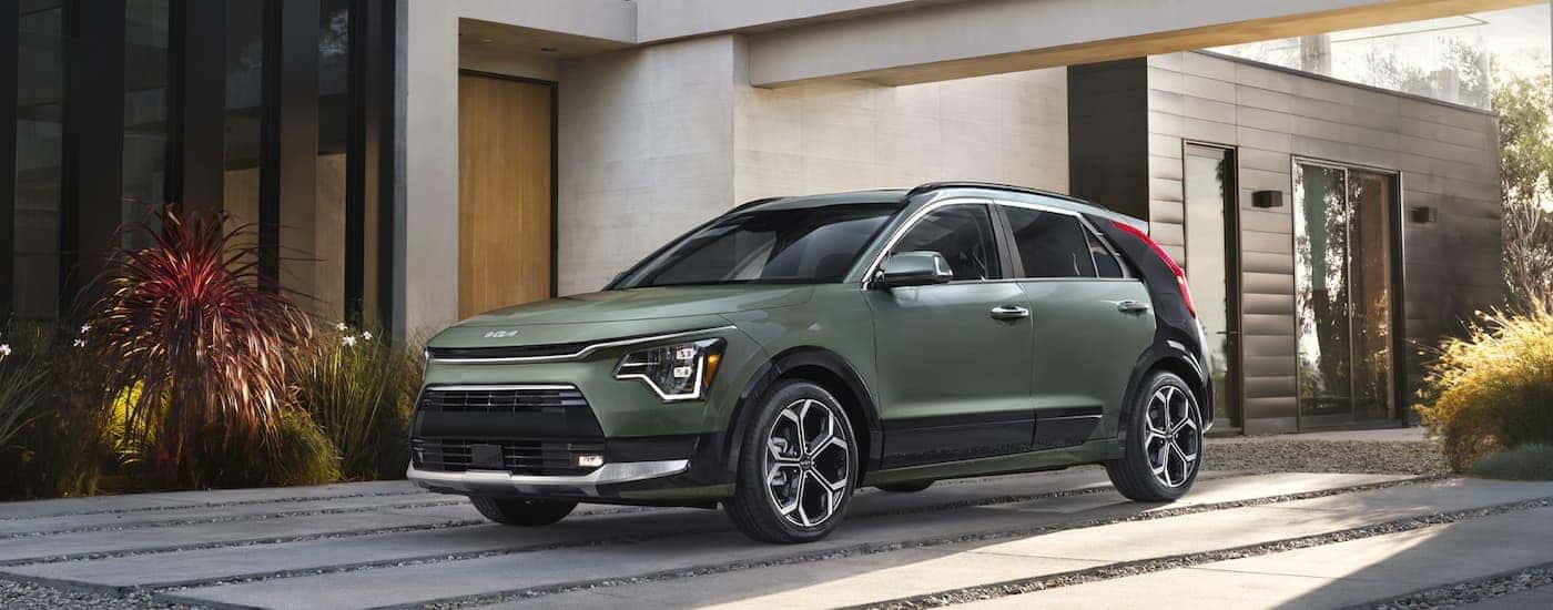 A green 2025 Kia Niro HEV is shown from the front at an angle.