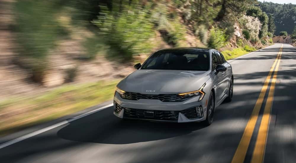A grey 2025 Kia K5 for sale from the front.