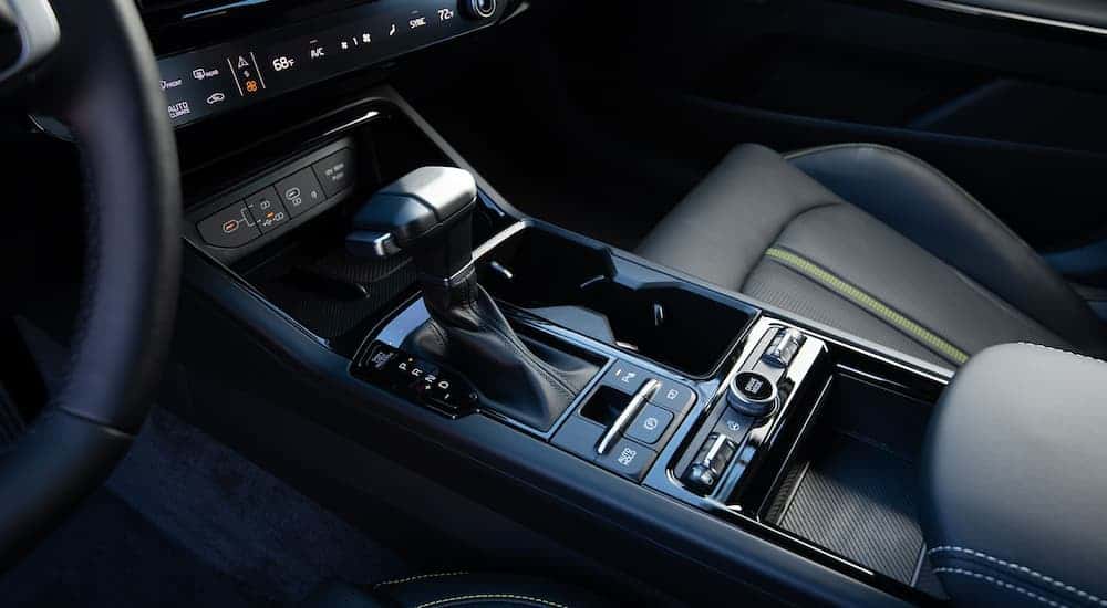 Close-up on the shifter and temperature controls inside a 2025 Kia K5.