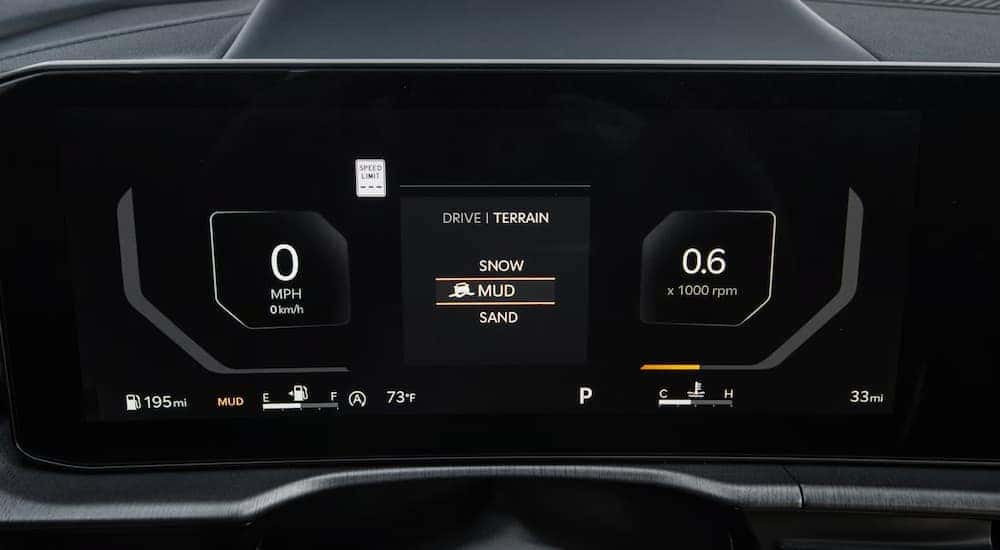 Digital gauges and drive terrain options on a 2025 Kia Sportage