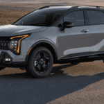 A gray 2025 Kia Sportage parked off-road