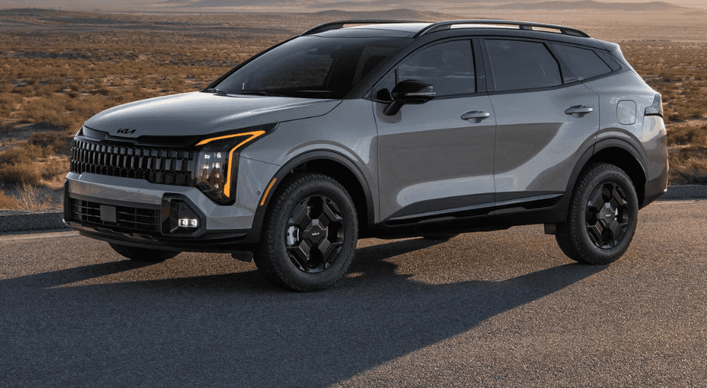 A gray 2025 Kia Sportage parked off-road