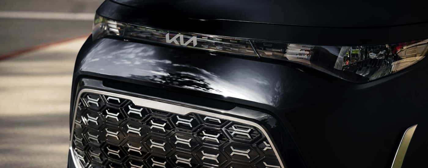 A close-up of the grille on a black 2024 Kia Soul for sale.