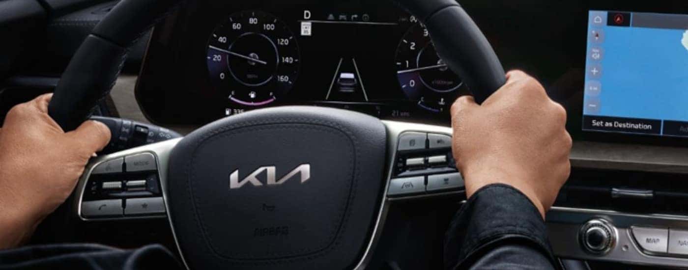 Close-up of the steering wheel and digital gauge cluster in a 2025 Kia Telluride