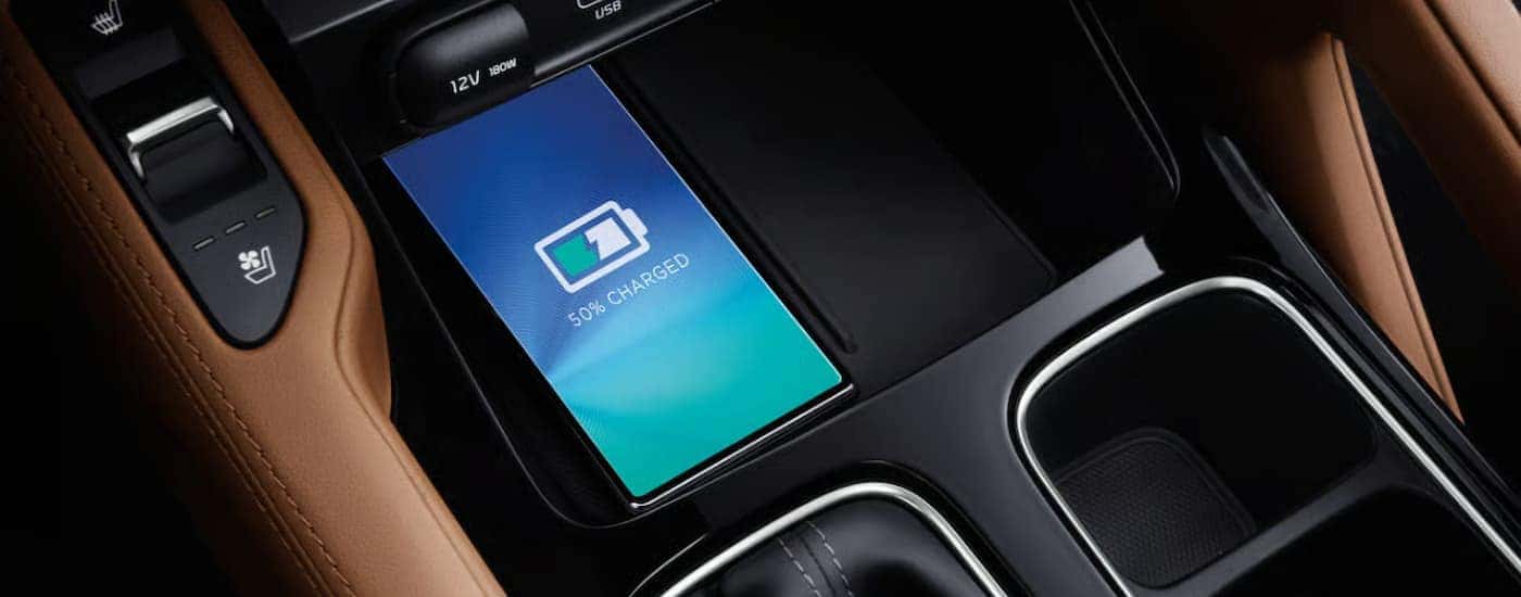 A phone wirelessly charging in a 2025 Kia Telluride for sale in Knoxville