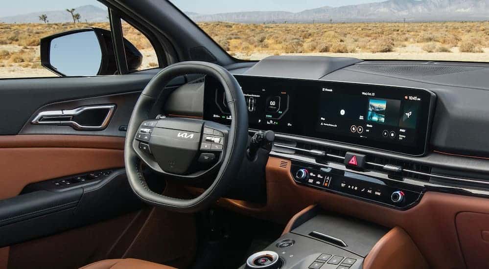 The black and brown dash in a 2026 Kia Sportage SX.