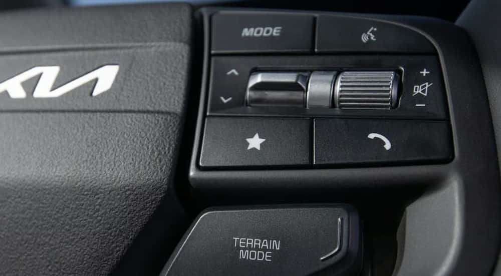 Close-up of the terrain mode buttons in a 2026 Kia Sportage X-Line for sale near Alcoa.