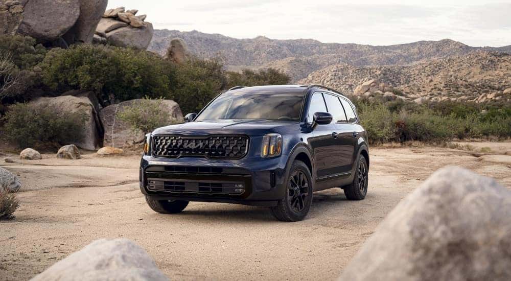 Black 2025 Kia Telluride for sale near Oak Ridge driving off-road.