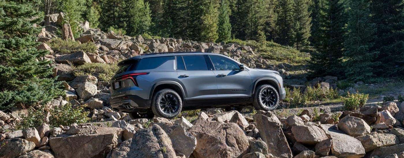 A silver 2025 Kia Telluride off-roading.