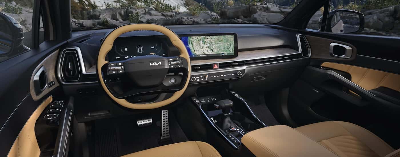 Black and tan interior of a 2025 Kia Sorento.