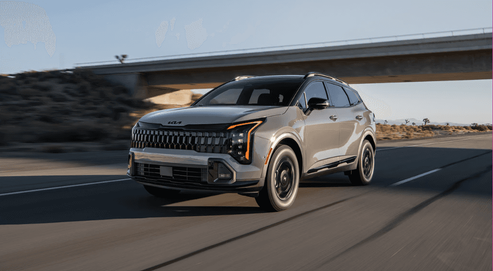 Grey 2026 Kia Sportage for sale near Clinton on a test drive