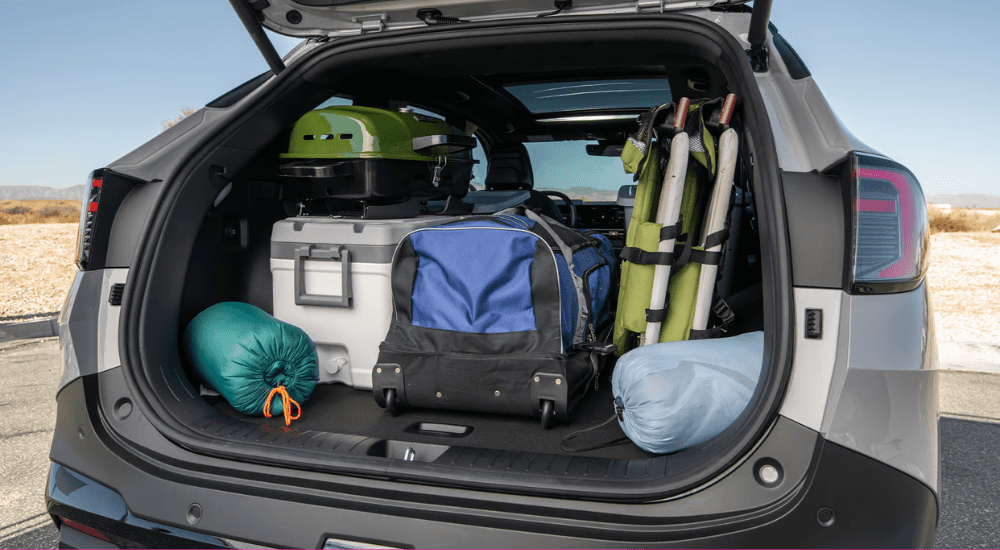 The trunk of a 2026 Kia Sportage filled equipment