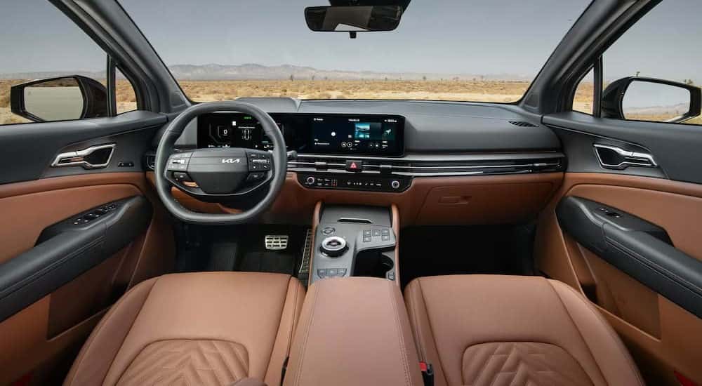 The black and brown interior and dash in a 2026 Kia Sportage Hybrid.