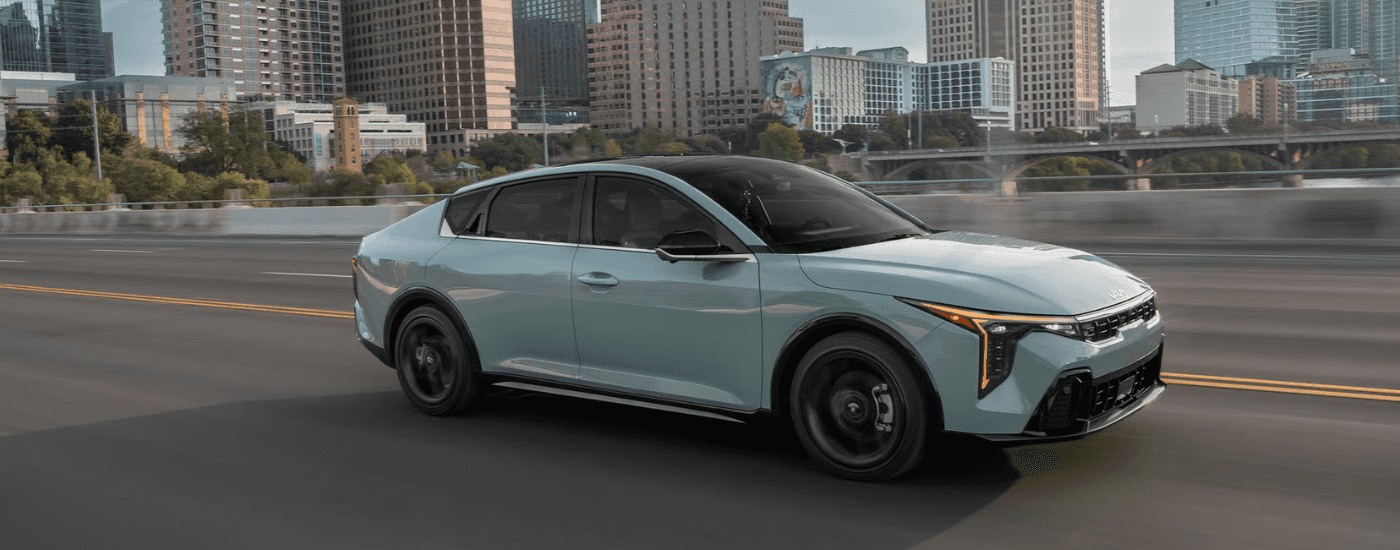 Blue 2026 Kia K4 for sale on a test drive