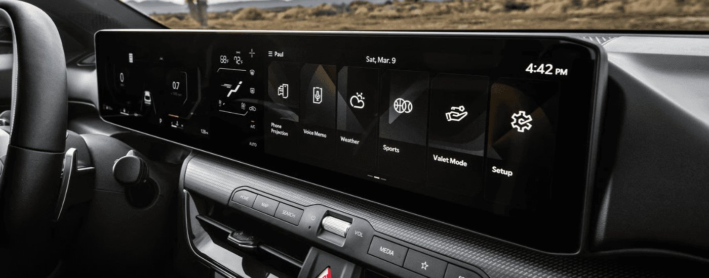 Infotainment system and black interior of a 2026 Kia K4