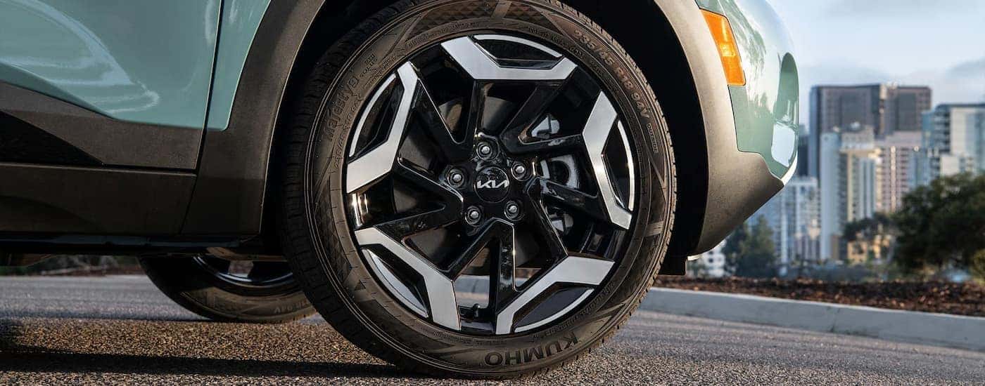 Tire and rim on a blue 2026 Kia Seltos